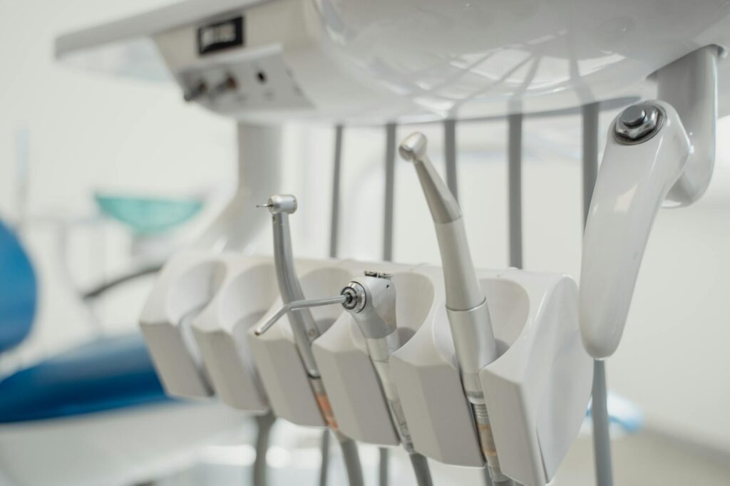 A dental lab technician working on a digital wax-up model.