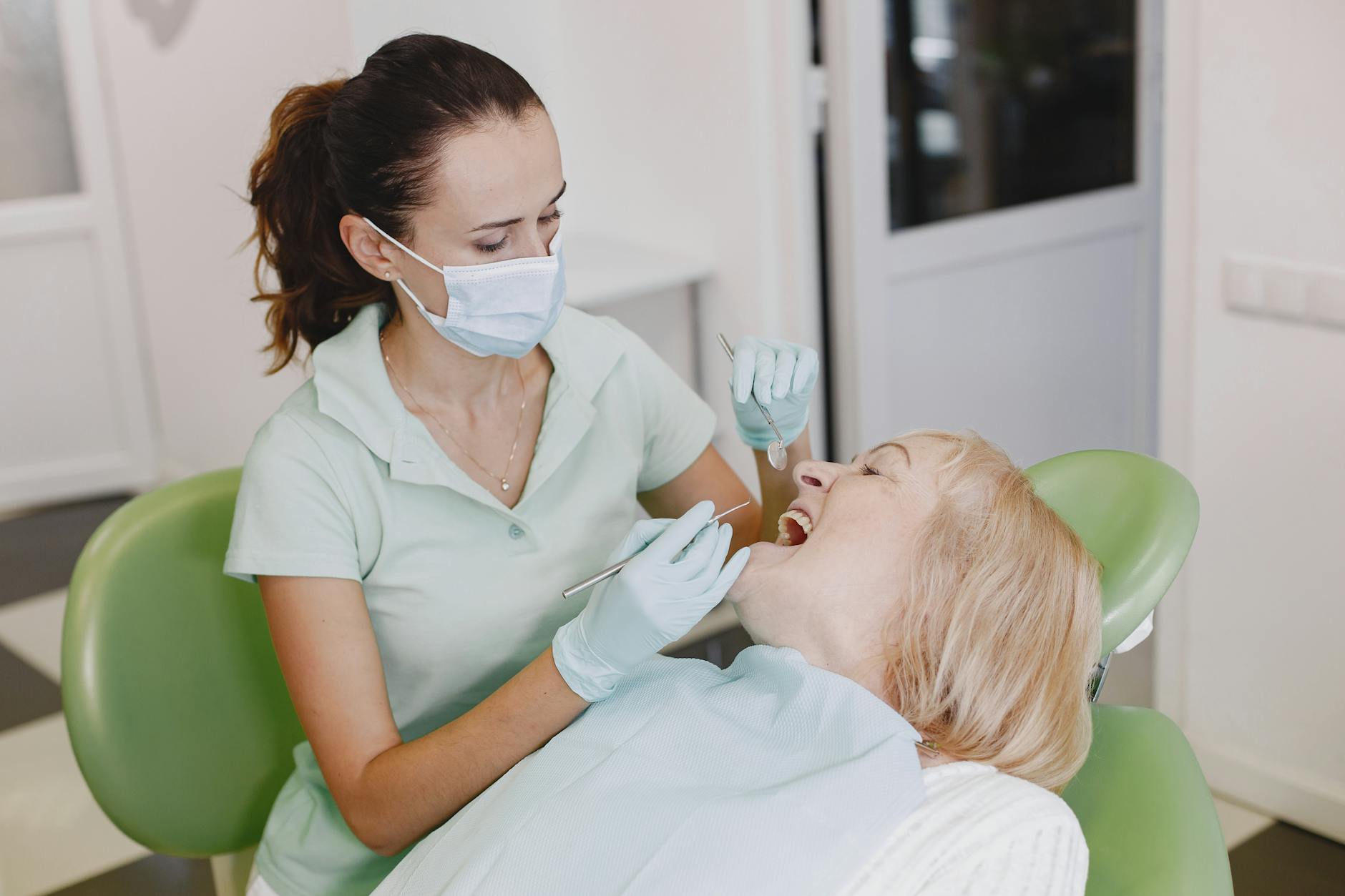 Smiling woman showcasing her teeth, potentially related to dental aesthetics.