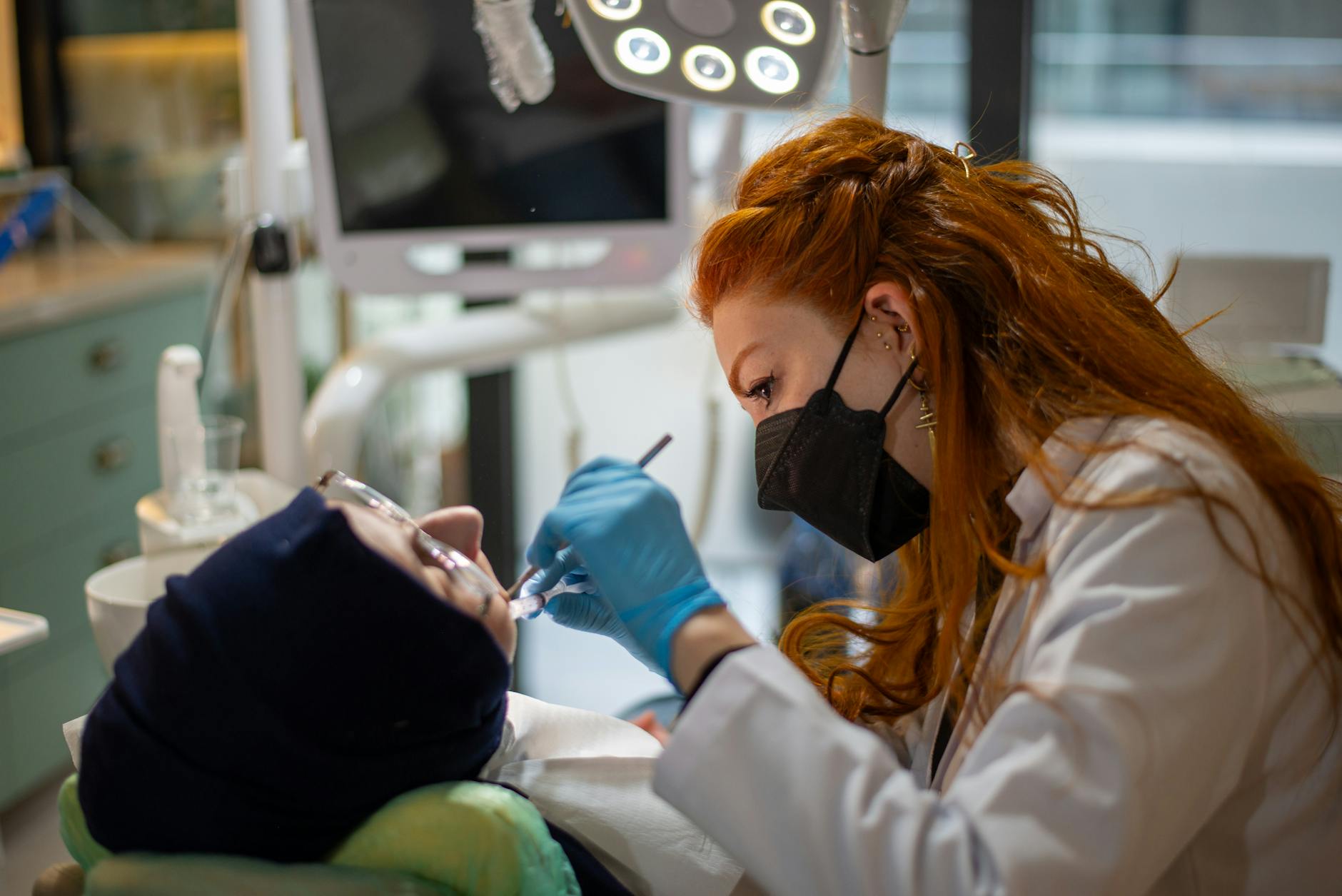 A person smiling with bright teeth, medical dental context not clear.